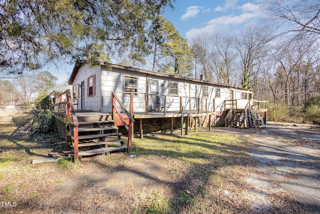 manufactured / mobile home with a wooden deck