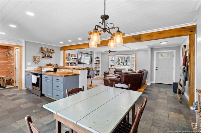 dining space featuring built in shelves, bar, and ornamental molding