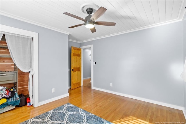 bedroom with ceiling fan, ornamental molding, and hardwood / wood-style floors