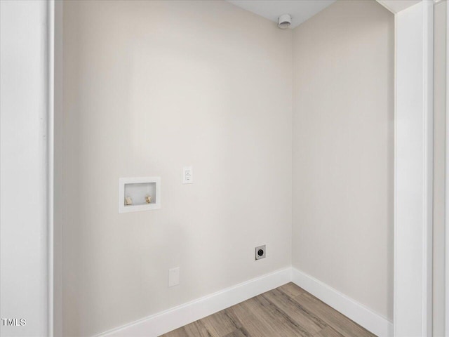 laundry area with electric dryer hookup, washer hookup, and hardwood / wood-style floors