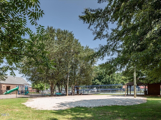 view of property's community with a playground and volleyball court