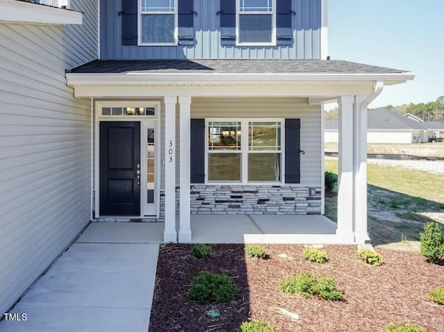 entrance to property with covered porch