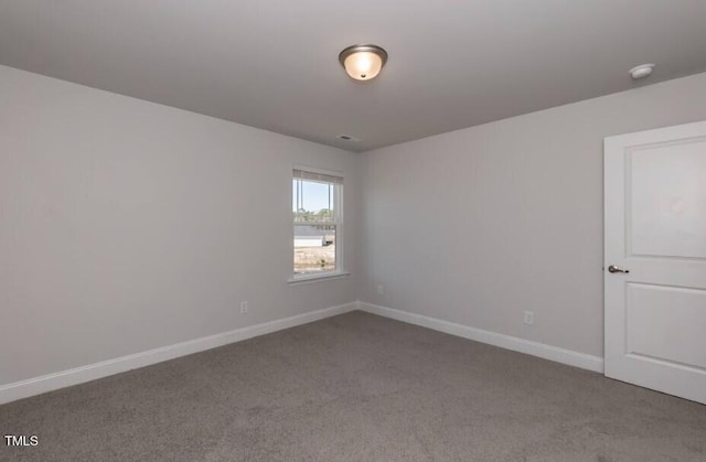 unfurnished room featuring carpet flooring