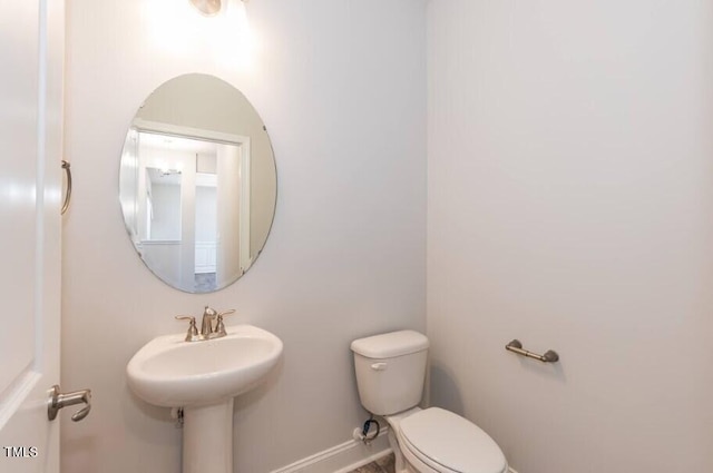 bathroom with toilet and sink