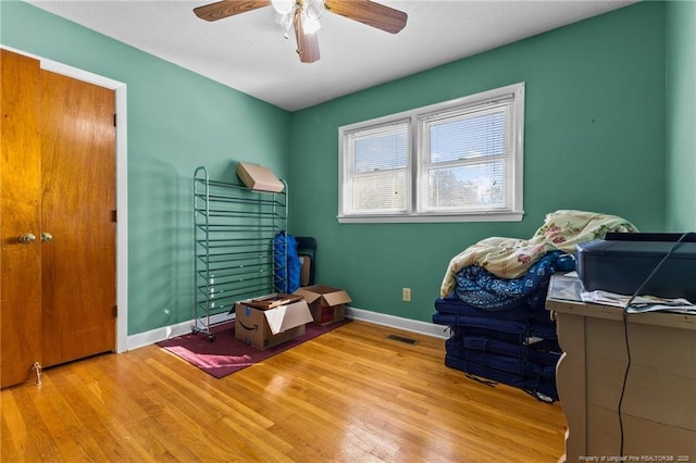 misc room featuring ceiling fan and light hardwood / wood-style floors