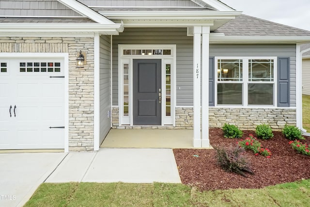 doorway to property featuring a garage