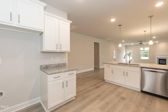 kitchen with white cabinetry, stainless steel dishwasher, and sink