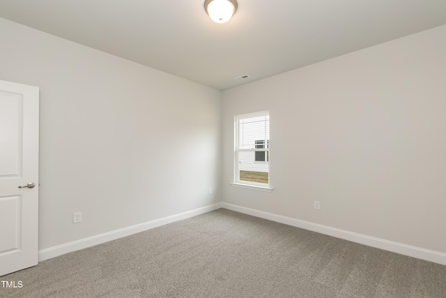 empty room with carpet flooring