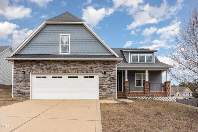 craftsman house with a porch and a garage