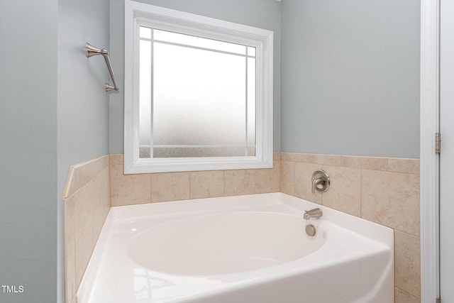 bathroom featuring a tub to relax in