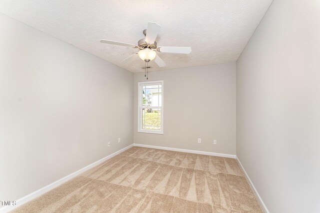 2228 Lakedale Dr, Fayetteville, NC 28306 - unfurnished room featuring light carpet, a textured ceiling, ceiling fan, and baseboards