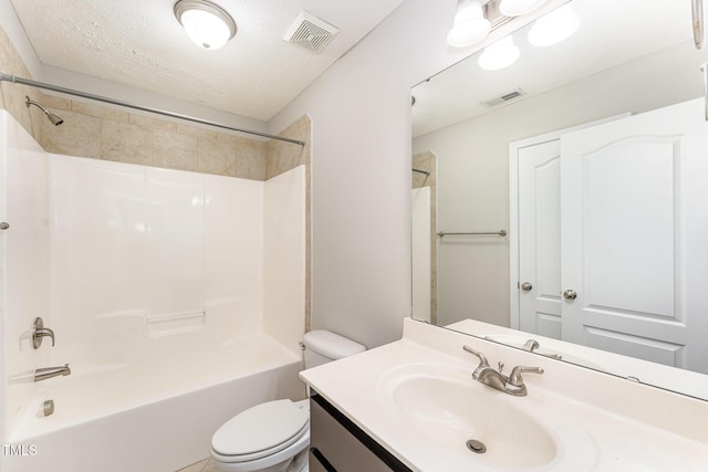 2228 Lakedale Dr, Fayetteville, NC 28306 - full bathroom with toilet, vanity, shower / washtub combination, and a textured ceiling