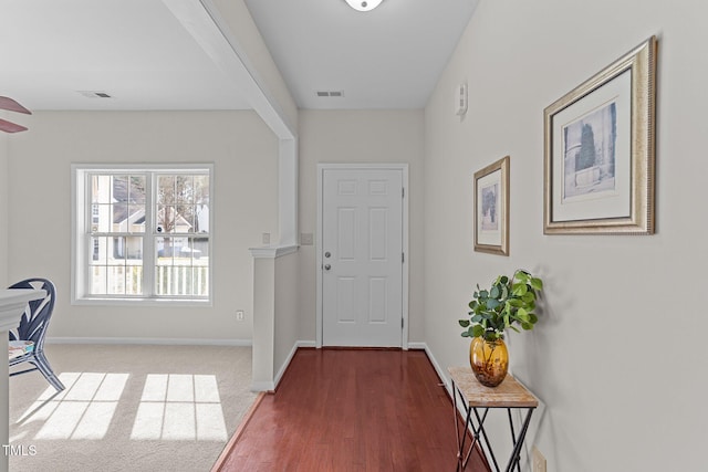 entryway with carpet floors