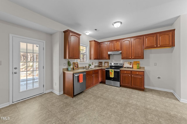 kitchen with sink and appliances with stainless steel finishes