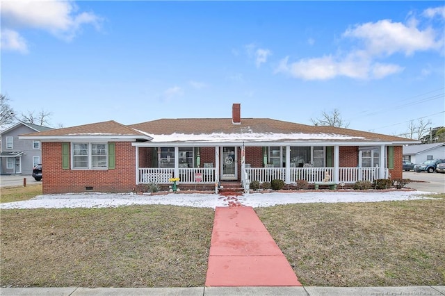 ranch-style home with covered porch and a front lawn