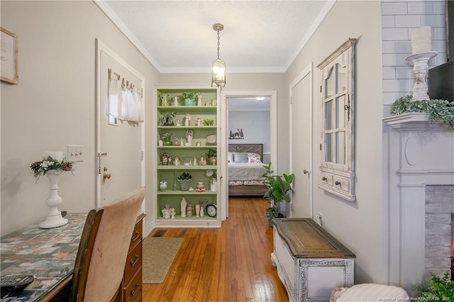 interior space with ornamental molding and light wood-type flooring