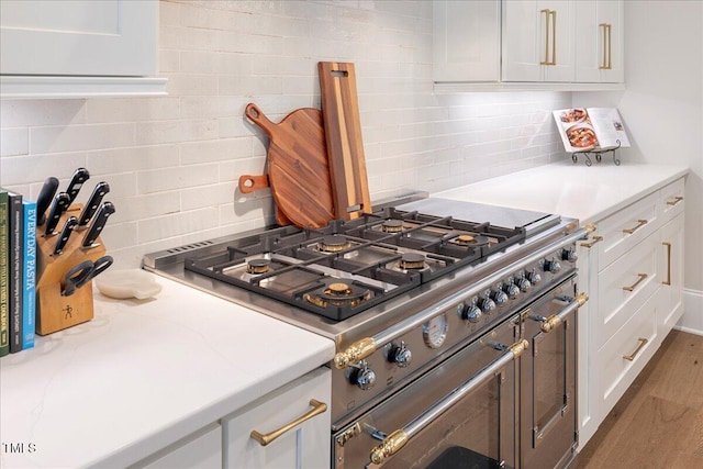 kitchen with white cabinetry and double oven range