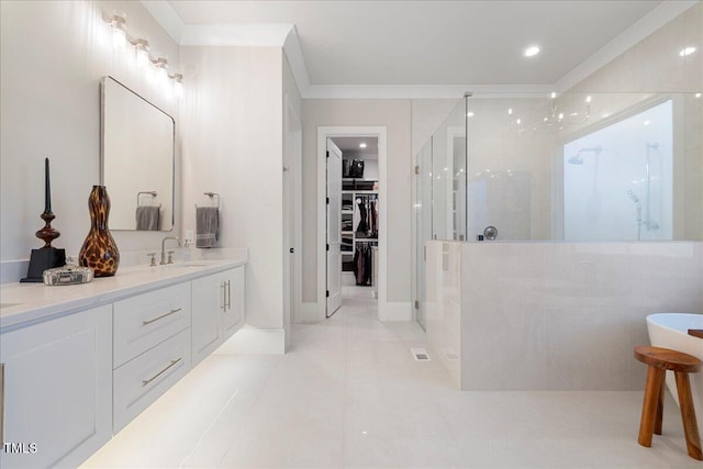 bathroom featuring an enclosed shower, vanity, crown molding, and tile patterned flooring