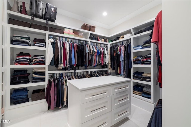 spacious closet with light tile patterned floors