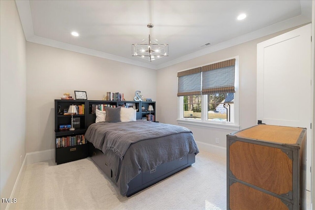 carpeted bedroom with a notable chandelier and crown molding