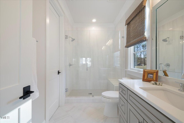 bathroom featuring a shower with door, vanity, and toilet