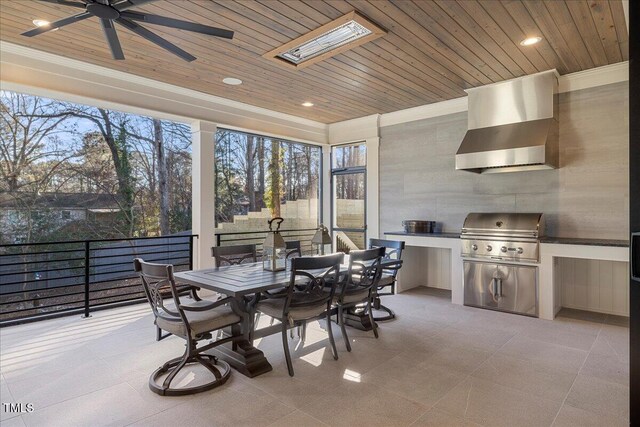 sunroom with wood ceiling and ceiling fan