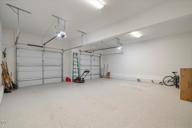 garage featuring a garage door opener