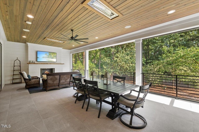 1304 Ivy Ln, Raleigh, NC 27609 - view of patio featuring a ceiling fan, an outdoor living space with a fireplace, and outdoor dining space