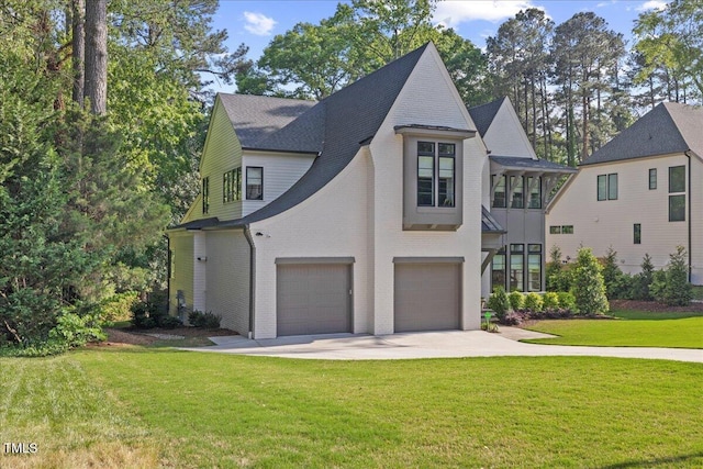 1304 Ivy Ln, Raleigh, NC 27609 - view of front of property featuring roof with shingles, an attached garage, a front lawn, brick siding, and driveway