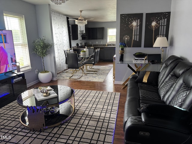 5430 Neuse Ridge Rd, Raleigh, NC 27610 - living room featuring wood finished floors and a chandelier