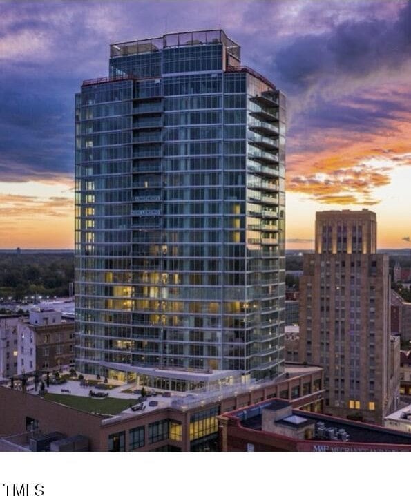 view of outdoor building at dusk