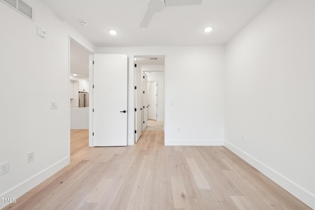 unfurnished room featuring baseboards, visible vents, light wood finished floors, recessed lighting, and ceiling fan