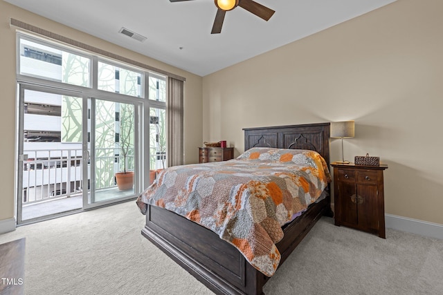 carpeted bedroom with ceiling fan, lofted ceiling, and access to outside