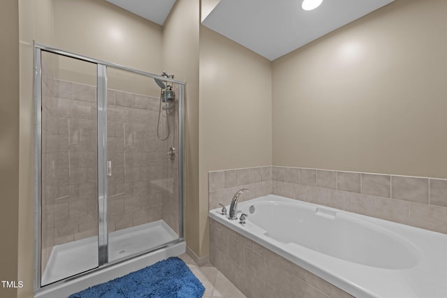 bathroom featuring separate shower and tub and tile patterned flooring