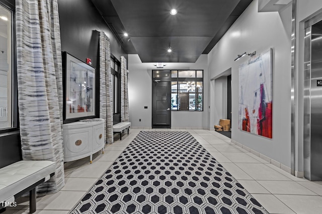 hallway featuring light tile patterned flooring