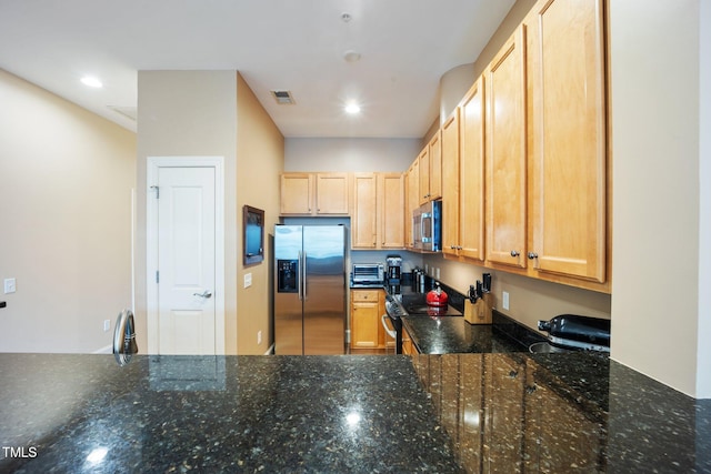 317 W Morgan St Unit 405, Raleigh, NC 27601 - kitchen featuring stainless steel appliances, dark stone countertops, light brown cabinets, and recessed lighting