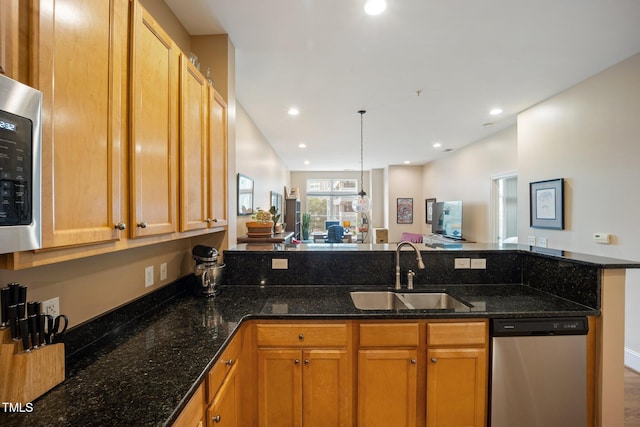 317 W Morgan St Unit 405, Raleigh, NC 27601 - kitchen featuring stainless steel appliances, a peninsula, dark stone counters, recessed lighting, and open floor plan