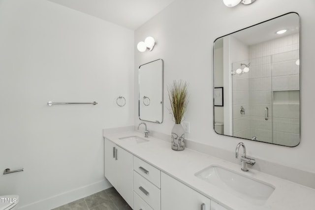 bathroom featuring vanity, toilet, an enclosed shower, and tile patterned flooring