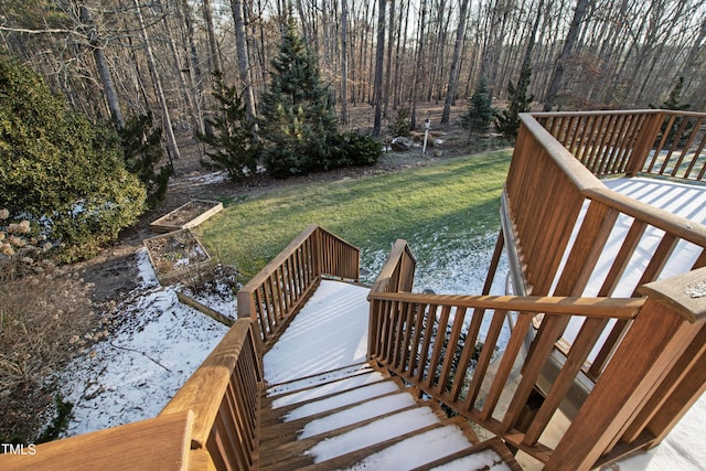 wooden deck with a lawn