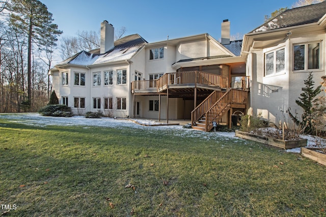 back of house with a wooden deck and a yard