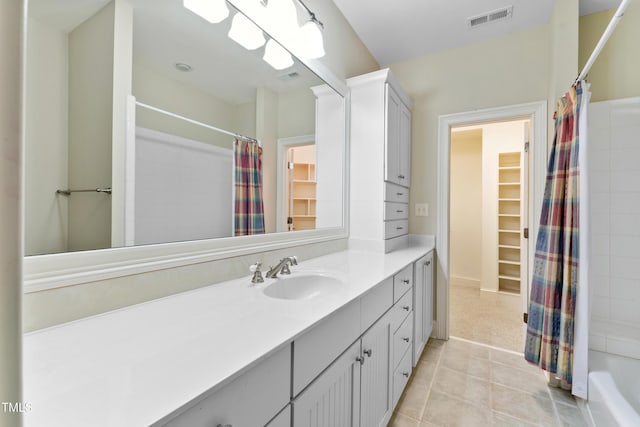 bathroom featuring vanity, tile patterned floors, and shower / bath combination with curtain