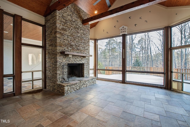 unfurnished living room featuring wood ceiling, a wealth of natural light, high vaulted ceiling, and beamed ceiling