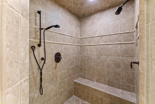 bathroom featuring tiled shower