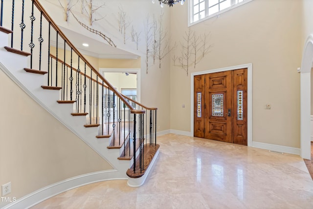 entrance foyer with a towering ceiling