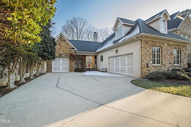 view of side of home with a garage