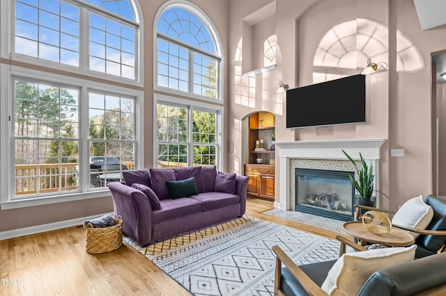 sunroom / solarium featuring a fireplace