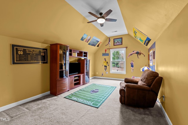 living area with light carpet, lofted ceiling, and baseboards