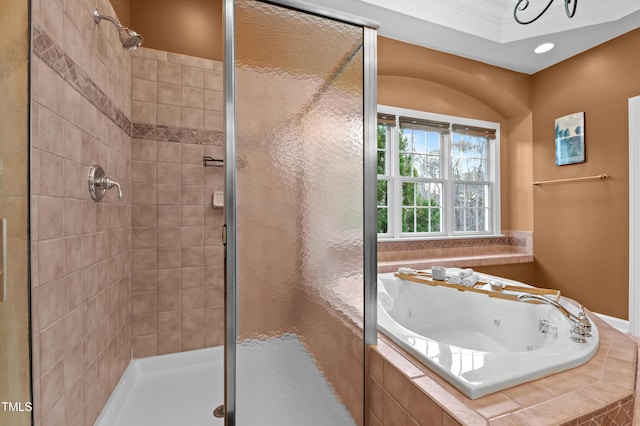 bathroom with a stall shower and a whirlpool tub