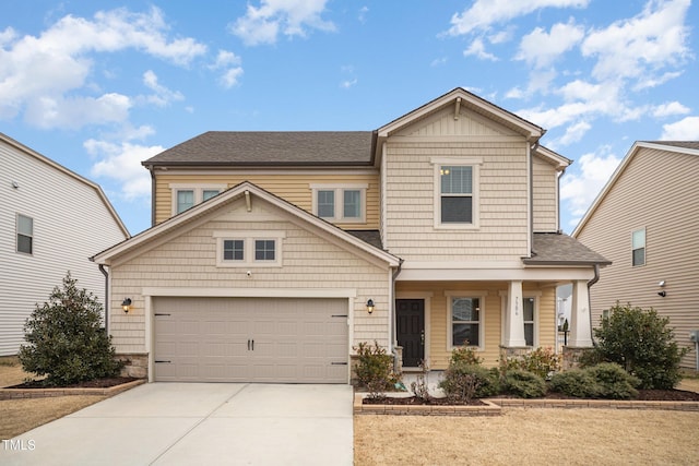 craftsman house with a porch and a garage