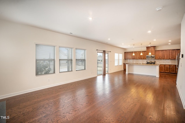 unfurnished living room featuring dark wood-type flooring